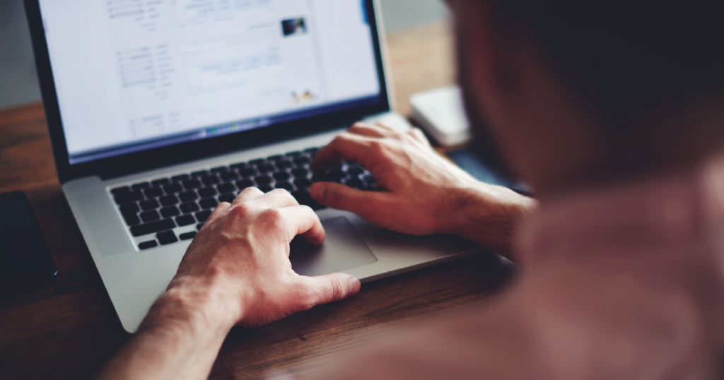 Person typing on a laptop computer